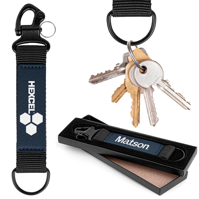 The Eldorado Heavy Duty Key Loop  - Forget bulky. Eldorado's tough webbing meets chic leather for a keychain that's built to conquer and styled to impress. Secure a metal clip and half-ring to keep keys close while you roam free. It's strength with a touch of class.