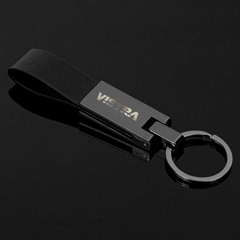 Gunmetal Tresana Key Chain - The Gunmetal Tresana Key Chain redefines the notion of everyday accessories. It's sleek and exudes an aura of sophistication that transcends fleeting trends. The key chain is a statement piece that speaks volumes about your discerning style. Metal is a zinc alloy with gunmetal plating. A metal and black leatherette strap construction. Gunmetal-plated zinc alloy for a touch of inviting charm. 35mm split ring with gunmetal plating for easy attachment. Gift box included for a stylish presentation.