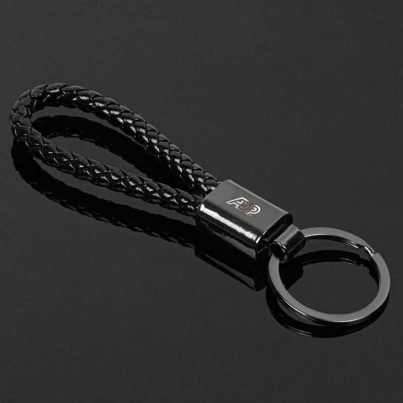 Gunmetal Braided Key Chain - Indulge in the timeless elegance and enduring durability of the Gunmetal Braided Key Chain, an accessory that seamlessly blends sophistication with practicality. Its braided leatherette strap exudes an air of refined craftsmanship, while the gunmetal-plated zinc alloy accents add a touch of modern flair. Metal is a zinc alloy with gunmetal plating. A metal and braided leather strap construction provides an elegant feel. Gunmetal-plated zinc alloy for a touch of inviting charm. Perfectly contoured for maximu