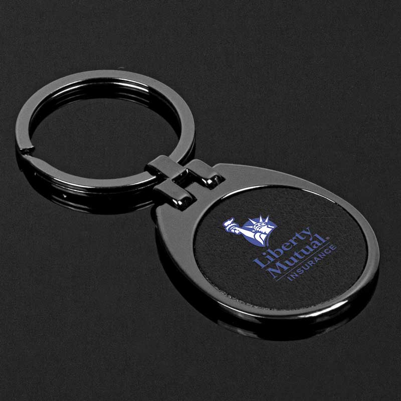 Gunmetal Westfield Key Chain - The The Gunmetal Westfield Key Chain exudes a captivating charm. Its semi-tear-drop shape, reminiscent of a hidden talisman adds a touch of sophistication to its presence. The black leather inset, set against the gunmetal backdrop, creates a striking contrast, hinting at the secrets it holds within. Metal is a zinc alloy with gunmetal plating. Black leather inset. All-metal construction for enduring elegance. Gunmetal-plated zinc alloy for a touch of inviting charm. Playful black infill on the door and wind