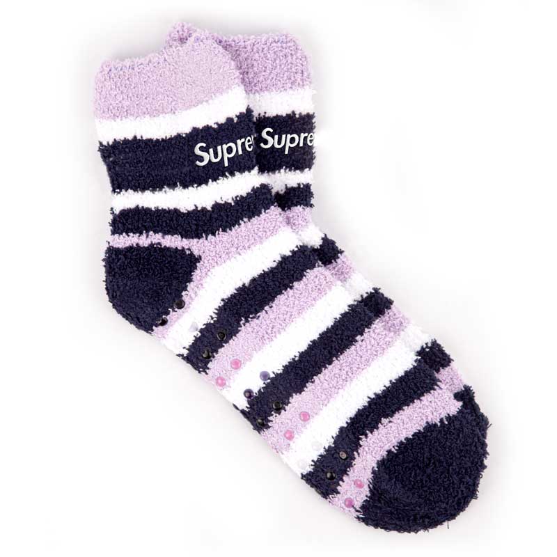 Soft Non-Slip Jacquard Grip Socks - One-color embroidered logo set against a customized jacquard sock. Up to 6 colors available for the sock. Features non-Slip soles. Quarter/anklet cut. One size fits all adults. 98% cotton 2% spandex. Comes in pairs.