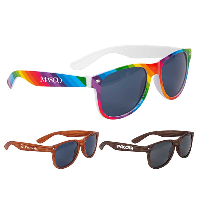 Kalani Rainbow/Wood Sunglasses - Three great styles to choose from! The Kalani sunglasses feature either a rainbow pattern, light, or dark wood patterns. Enjoy the same benefits as our other sunglasses: Poly carbonate lenses with UV400 to provide 100 percent UVA and UVB protection. Price includes imprint on one arm only. Imprint on 2nd arm available. 